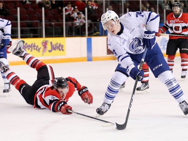 Ryan Orban dives to stop Owen Tippet in the second period as the Ottawa 67's take on the Mississauga Steelheads in game 4 of Ontario Hockey League playoff action at TD Place Arena.