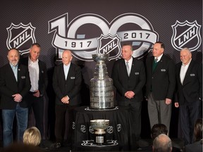 Guy Lafleur, third from right, stands next to the Stanley Cup during Friday's outdoor-game media event at the Fairmont Château Laurier. Also in this photo are, left, to right, Bryan Trottier, Paul Coffey, Dave Keon, Frank Mahovlich and Bernie Parent. Mike Bossy is not in this frame.  Wayne Cuddington/Postmedia