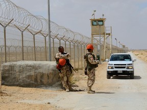 This 2013 photo shows Colombian members of the Multinational Force and Observers (MFO) guarding the perimeter at North Camp in Sinai, Egypt. DND photo.