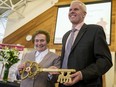 Sister Rachelle Watier, general superior, Sisters of Charity of Ottawa passes a symbolic key to Daniel Levac, president and CEO, Bruyère Continuing Care on March 24, 2017.