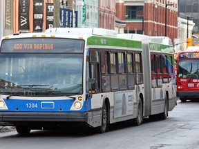 An STO bus and an OC Transpo bus on Rideau Street on Jan. 17, 2017.