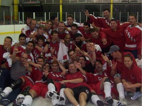 Alex Burrows, near the bottom middle in a black T-shirt, and his teammates celebrate their 2005 world championship.