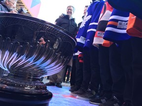 Mayor Jim Watson looks on as the original Challenge Cup was on display during the groundbreaking ceremony for the Stanley Cup monument on Sparks Street on Saturday, March 18, 2017.