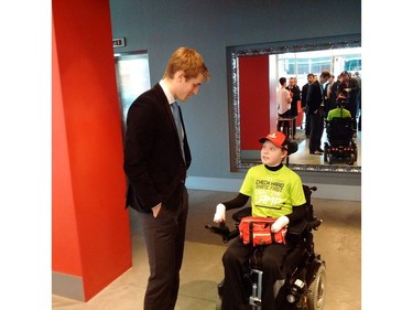 Jonathan Pitre and Kyle Turris, who stay in touch by email, talk during the Senators' visit.