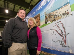 Walter Brooks and Nancy Dofflmyer of the Golf Harrison Group in Ocean City, Md., are among those trying to entice Ottawa-area golfers at the GolfExpo this weekend.    Wayne Cuddington/Postmedia