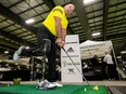 Todd Keirstead demonstrates setting with a prosthetic-leg device for a demonstration of his Bring Back the Game program aimed at getting injured or wounded veterans and civilians back into golf. Wayne Cuddington/Postmedia