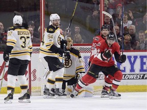 Senators centre Jean-Gabriel Pageau (44) celebrates after scoring against Bruins netminder Tuuka Rask (40) with a tip-in during the first period on Monday night.