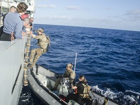 The United States Coast Guard Law Enforcement Detachment boards Her Majesty’s Canadian Ship SASKATOON on March 12, 2017, the morning after the seizure of 660 kg of cocaine from a panga-style vessel in the Eastern Pacific on Operation CARIBBE. 
Photo: Royal Canadian Navy Public Affairs
XC051-2017-0001-157