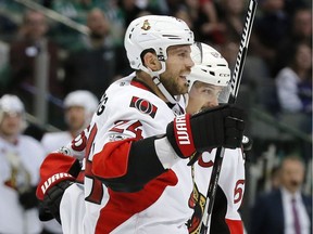 Ottawa Senators' Viktor Stalberg (24) of Sweden and Erik Karlsson, right, celebrate a goal by Stalberg against the Dallas Stars in the second period of an NHL hockey game in Dallas, Wednesday, March 8, 2017.