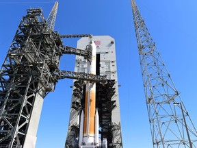 The United Launch Alliance Delta IV rocket carrying the ninth Wideband Global Satellite Communication satellite emerges as the Mobile Service Tower is rolled back March 18, 2017, at Cape Canaveral Air Force Station, Fla. WGS satellites are important elements of a new high-capacity satellite communications system providing enhanced communications capabilities to our troops in the field. Painted on the rocket are tributes to the international partners, ULA and the official logo of the U.S. Air Force’s 70th anniversary.(U.S. Air Force photo by Airman Holden S. Faul/ Released)