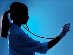 DIRECTINPUT~  This image has been directly inputted by the user. The photo desk has not viewed this image or cleared rights to the image. Woman doctor holding stethoscope silhouette in studio ORG XMIT: POS1610201719205055