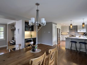 The family's dining room was relocated into the previous 'flexible' space. The kitchen and family room's walls were torn down to create an open concept floor plan with lots of flow and space.