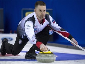 Team Canada skip Brad Gushue makes a shot during a draw against Switzerland at the Men&#039;s World Curling Championships in Edmonton, Saturday, April 1, 2017. THE CANADIAN PRESS/Jonathan Hayward