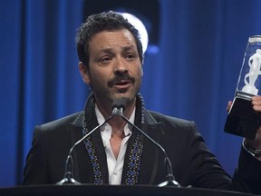 Adam Cohen, son of Leonard Cohen accepts the award on behalf of his father for the Artist of the Year at the Juno Gala awards show in Ottawa, Saturday, April 1, 2017. Leonard Cohen died in Los Angeles on November 7, 2016. THE CANADIAN PRESS/Sean Kilpatrick
