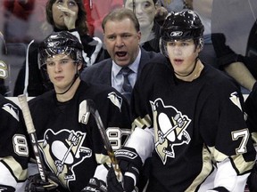 Pittsburgh Penguins&#039; Evgeni Malkin, right, waits between shifts with coach Michel Therrien, center, and teammate Sidney Crosby during their hockey game against the New Jersey Devils in Pittsburgh, Wednesday, Oct. 18, 2006. As far as sophomore seasons go Sidney Crosby had one of the best the league had ever seen — and tops in recent memory. THE CANADIAN PRESS/AP/Gene J. Puskar