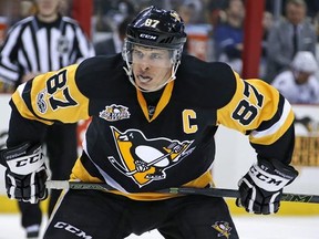 FILE - In this March 3, 2017, file photo, Pittsburgh Penguins&#039; Sidney Crosby prepares for a face-off in the second period of an NHL hockey game against the Tampa Bay Lightning in Pittsburgh. Players are raising doubts about the finality of the NHL announcement that it won‚Äôt participate in the 2018 Olympics. Two-time Olympic gold-medal-winner Sidney Crosby said it was disappointing. (AP Photo/Gene J. Puskar, File)