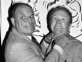 FILE - In this Nov. 10, 1977 file photo, comedian Don Rickles, left, pretends to strangle fellow comedian Red Buttons prior to an Annual Stag Roast in Los Angeles. Rickles died Thursday, April 6, 2017, of kidney failure at his Los Angeles home. He was 90. (AP Photo/ Lennox McLendon, File)