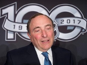FILE - This March 17, 2017 file photo shows NHL Commissioner Gary Bettman speaking with the media following a news conference in Ottawa. The NHL announced Monday, April 3, 2017 that it will not participate in the 2018 Winter Olympics in South Korea, saying it sees no tangible benefit in halting its season for three weeks next February despite clear signs from the world&#039;s best players that they want to go. (Adrian Wyld/The Canadian Press via AP, file)