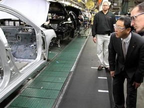 FILE - In this Thursday, Feb. 25, 2010, file photo, production team member Steve Turley, right, and Toyota President Akio Toyoda look into a Camry on the assembly line at the Toyota Motor Manufacturing plant in Georgetown, Ky. Toyota said Monday, April 10, 2017, it is investing $1.3 billion to retool its sprawling Georgetown factory, where the company&#039;s flagship Camry sedans are built. No new factory jobs are being added, but Toyota says the upgrades amount to the biggest single investment ever
