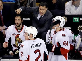 Ottawa Senators coach Guy Boucher instructs his players during the third period of the team&#039;s NHL hockey game against the Boston Bruins, Thursday, April 6, 2017, in Boston. (AP Photo/Elise Amendola)