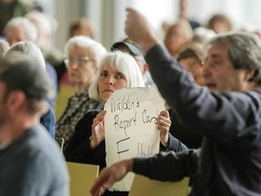 People react as U.S. Rep. Greg Walden speaks at a town hall meeting in The Dalles, Oreg., Wednesday, April 12, 2017. (Stephanie Yao Long/The Oregonian via AP)