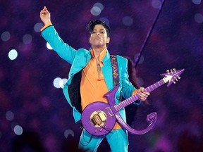 FILE - In this Feb. 4, 2007, file photo, Prince performs during the halftime show at the Super Bowl XLI football game in Miami. Nearly a year after Prince died from an accidental drug overdose in his suburban Minneapolis studio and estate, investigators still haven&#039;t interviewed a key associate nor asked a grand jury to investigate potential criminal charges, according to an official with knowledge of the investigation. (AP Photo/Chris O&#039;Meara, File)