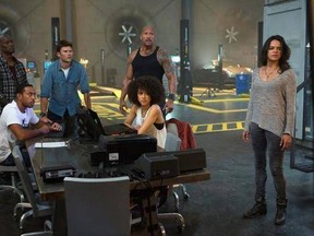 This image released by Universal Pictures shows, Chris &ampquot;Ludacris&ampquot; Bridges, seated left, and Nathalie Emmanuel, seated right, and Tyrese Gibson, standing from left, Scott Eastwood, Dwayne Johnson and Michelle Rodriguez in &ampquot;The Fate of the Furious.&ampquot; (Matt Kennedy/Universal Pictures via AP)