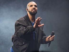 FILE - In this Oct. 8, 2016 file photo, Drake performs onstage in Toronto. Authorities say an intruder was arrested at Drake‚Äôs Southern California house, but the woman apparently did nothing but drink the rapper‚Äôs water and soda pop. The Los Angeles County Sheriff‚Äôs Department says deputies from its Malibu/Lost Hills Station arrested 24-year-old Mesha Collins Monday, April 17, 2017, inside the home of Drake, whose real name is Aubrey Graham. (Photo by Arthur Mola/Invision/AP, File)