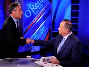 FILE - In this Sept. 22, 2010 file photo, Jon Stewart, from Comedy Central&#039;s &ampquot; &ampquot;The Daily Show with Jon Stewart,&ampquot; left, shakes hands with Bill O&#039;Reilly during the taping of a segment on &ampquot;The O&#039;Reilly Factor,&ampquot; on the FOX News Channel, in New York. (AP Photo/Peter Kramer, File)