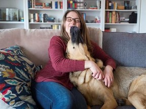 Monica Finlay hangs out with her dog Ozzie in Guelph, Ont. on Wednesday, March 29, 2017. Finaly and her husband have been spending $45 a month for pet insurance since they got their German shepherd mix, Ozzie, about six years ago. THE CANADIAN PRESS/Hannah Yoon