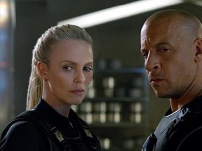 his image released by Universal Pictures shows Charlize Theron, left, and Vin Diesel in 'The Fate of the Furious.'