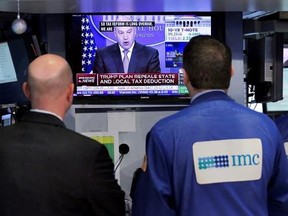 Specialists on the floor of the New York Stock Exchange watch Gary Cohn, director of the White House National Economic Council, Wednesday, April 26, 2017. President Donald Trump proposed dramatic cuts in the taxes paid by corporations big and small Wednesday in an overhaul his administration says will spur economic growth and bring jobs and prosperity to America&#039;s middle class. (AP Photo/Richard Drew)