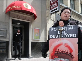 A protester stands outside the Morgentaler Clinic in Ottawa.