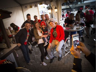 A crew of Sen's fans get their photo taken at St. Louis Bar and Grill on Elgin along Sens Mile Sunday April 23, 2017.   Ashley Fraser/Postmedia