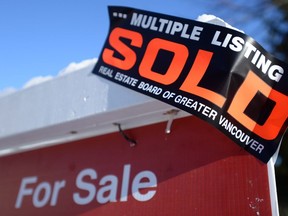 A real estate sold sign is shown outside a house in Vancouver, Tuesday, Jan.3, 2017. Royal LePage says early evidence suggests that the recent correction in Vancouver's housing market may be short-lived.