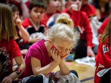 A student at A. Lorne Cassidy Elementary School dozes off during a rally with former players Chris Phillips and Shaun Van Allen.