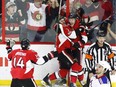 The Ottawa Senators' Ryan Dzingel celebrates his Game 1 power-play goal with teammates centre Kyle Turris and Alex Burrows.