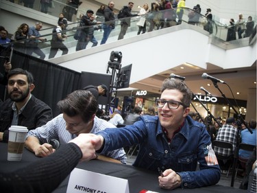 Anthony Carone, vocals, keyboard and guitar player with the Arkells, reaches out to shake a hand of a fan. The Rideau Centre was full of Canadian celebrities and eager fans lining up for autographs on Saturday, April 1, 2017 as Juno Fan Fare took place.