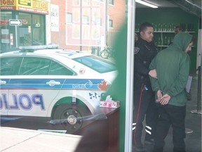 Ottawa police make an arrest at a Cannabis Culture outlet in Ottawa in March.