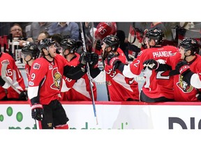 Bobby Ryan is congratulated by the bench after scoring in the second period.