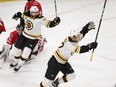 Sean Kuraly, front, starts to celebrate after scoring the winning goal for the Bruins midway through the second overtime period.