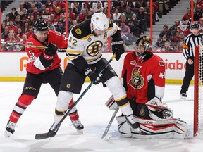 The Bruins' David Backes battles in front of Senators goalie Craig Anderson in Game 1. Backes said the Boston players had a 'frank conversation' after being held without a single shot in the second period.