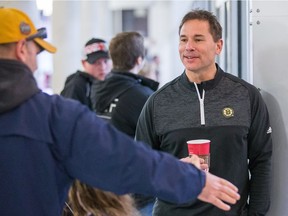 Bruins coach Bruce Cassidy chats with a fan in lobby of the Bell Sensplex on Friday.