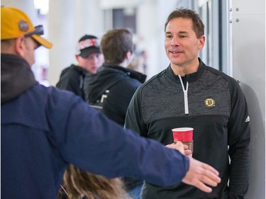 Boston coach Bruce Cassidy chats with a fan in lobby of the Sensplex as the Ottawa Senators practice at the Bell Sensplex in advance of their next NHL playoff game against the Boston Bruins on Saturday. The Bruins are up 1-0 in a best of seven series.