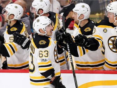 The Bruins' Brad Marchand is congratulated on what turned out to be the game-winning goal in the third period at the Canadian Tire Centre on Wednesday, April 12, 2017.