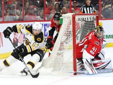 Brad Marchand of the Boston Bruins does a wraparound that led to his team's first goal against goalie Craig Anderson.