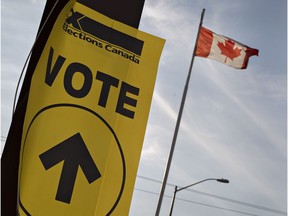 An Elections Canada sign directs voters on Monday October 19, 2015.