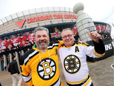 Brent Buffett and Dan Racine from North Bay sport their Bruins jerseys in the Red Zone before Game 1.