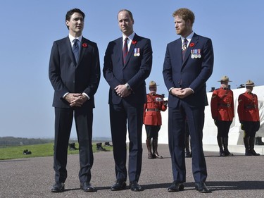 Canadian Prime Minister Justin Trudeau, left, Britain's Prince William, Duke of Cambridge and Britain's Prince Harry, right, stand during commemorations of the 100th anniversary of the Battle of Vimy Ridge at the WWI Canadian National Vimy Memorial in Vimy, France, Sunday, April 9, 2017. The commemorative ceremony at the memorial honors Canadian soldiers who were killed or wounded during the Battle of Vimy Ridge in April 1917.