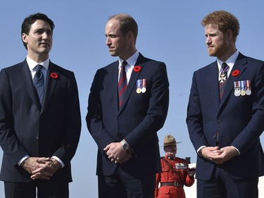 Canadian Prime Minister Justin Trudeau, left, Britain's Prince William, Duke of Cambridge and Britain's Prince Harry, right, stand during the commemorations of the 100th anniversary of the Battle of Vimy Ridge at the WWI Canadian National Vimy Memorial in Vimy, France, Sunday, April 9, 2017. The commemorative ceremony at the memorial honors Canadian soldiers who were killed or wounded during the Battle of Vimy Ridge in April 1917.